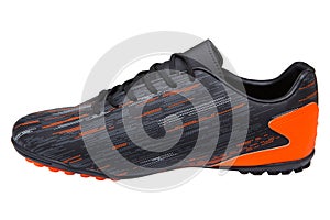 Football shoes with soft spikes, black with orange inserts, on a white background