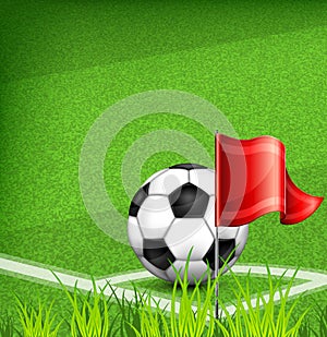 Football (soccer) ball on corner of field and flag