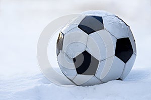 Football, soccer ball on snow