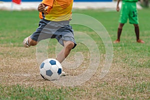 Football soccer children training class. Kindergarten and elementary school kids playing football in a field. Group of boys