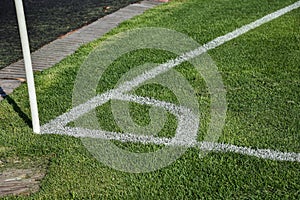 Football or soccer field corner with white marks