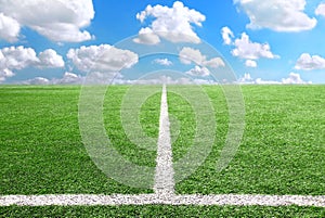 Football and soccer field grass stadium Blue sky background