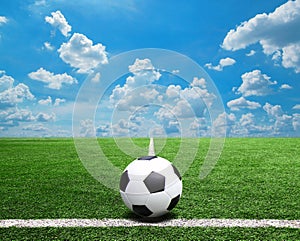 Football and soccer field grass stadium Blue sky background