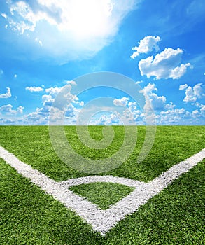 Football and soccer field grass stadium Blue sky background