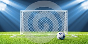 Football (soccer) goals and ball on clean empty gr