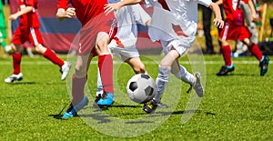 Football Soccer Kick. Soccer Players Duel. Children Playing Football Game on Sports Field. Boys Play Soccer Match on Green Grass