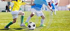 Football soccer match for children. Boys playing football game