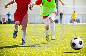 Football soccer match for children. Boys playing football game