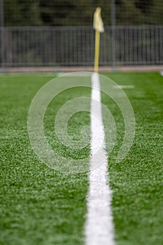 Football (Soccer) pitch and a cloudy sky. Green field