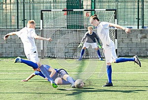 Football soccer players with ball. Footballers kicking football match on the pitch