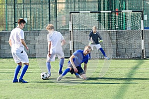 Football soccer players with ball. Footballers kicking football match on the pitch