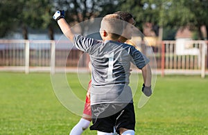 Football soccer players celebrating after goal