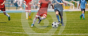 Football Soccer Players Running with Ball. Footballers Kicking Football Match photo