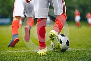 Football/Soccer Running with the Ball.Close-up View of Soccer Ball and Player Leg