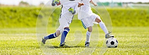 Football soccer training for kids. Children football training se Kids running and kicking soccer balls. Young boys improving socce