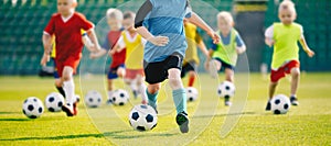 Football soccer training for kids. Young boys improving soccer skills Children football training