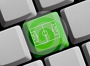 Football stadium or soccer pitch on computer keyboard