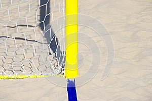 Football summer sport. closeup goal net on a sandy beach outdoor