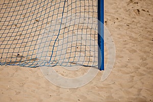 Football summer sport. goal net on a sandy beach