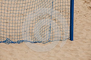 Football summer sport. goal net on a sandy beach