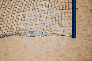 Football summer sport. goal net on a sandy beach