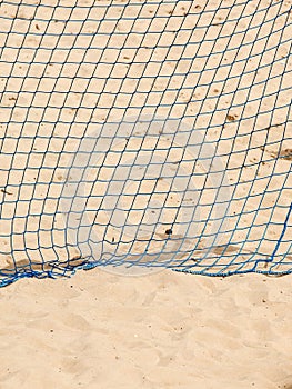 Football summer sport. goal net on a sandy beach