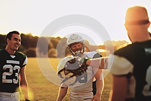 Football team laughing at practice