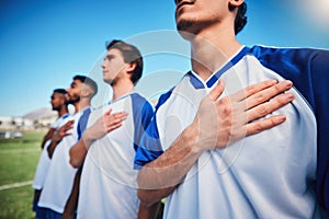 Football team, national anthem and listening at stadium before competition, game or match. Soccer, song and sports