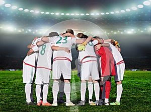 Football team players Hug the neck and for pray before playing
