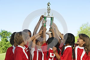 Football Team Raising Trophy