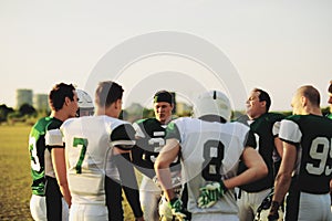 Football team talking together at practice