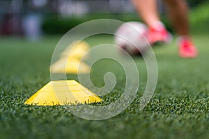 Football training action scene on turf ground.