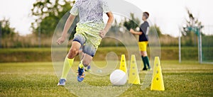 Football Training Drills - Boundary Slalom Marker Cones. Player Running Fast With Ball at Practice Pitch