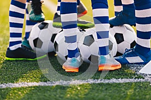 Football Training. Legs of Young Soccer Boys. Football Academy Team Training with Balls