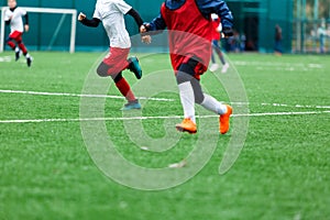 Football training soccer for kids. Boy runs kicks dribbles soccer balls. Young footballers dribble and kick football ball in game photo