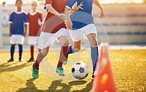 Football Training. Young Soccer Players Running with the Ball. Boys Kicking Football Ball. Soccer Youth Teams Play Outdoor