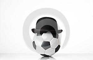 Football wearing a bowler hat