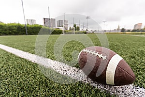 Football on Yardage Marker. Low Angle. Horizontal View