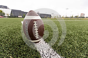 Football on Yardage Marker. Low Angle. Horizontal View