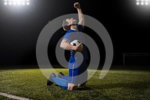 Footballer celebrating a goal in match