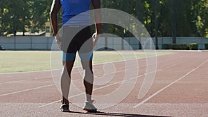 Footballer keeping his body and muscles tone, training hard at stadium, sports