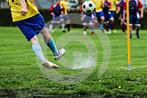 Footballer kicking the ball during the football match