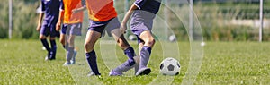 Footballers on Football Training Camp. Young Players Kicking Soccer on Practice Session photo