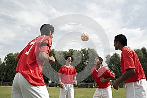 Footballers Heading The Ball photo