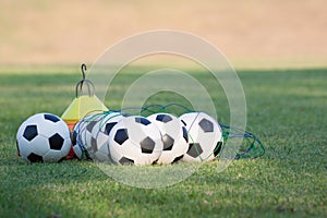 Footballs for training on a grass lawn of sport club photo