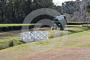 Footbridge and harvestor at the Charleston Tea Plantation