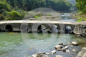 Footbridge over River with Five Round Arches