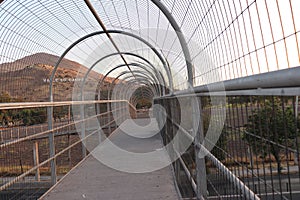 footbridge with security fence photo