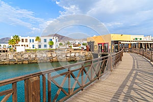 Footbridge and traditional buildings in Rubicon marina photo