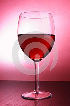 Footed glass of red wine